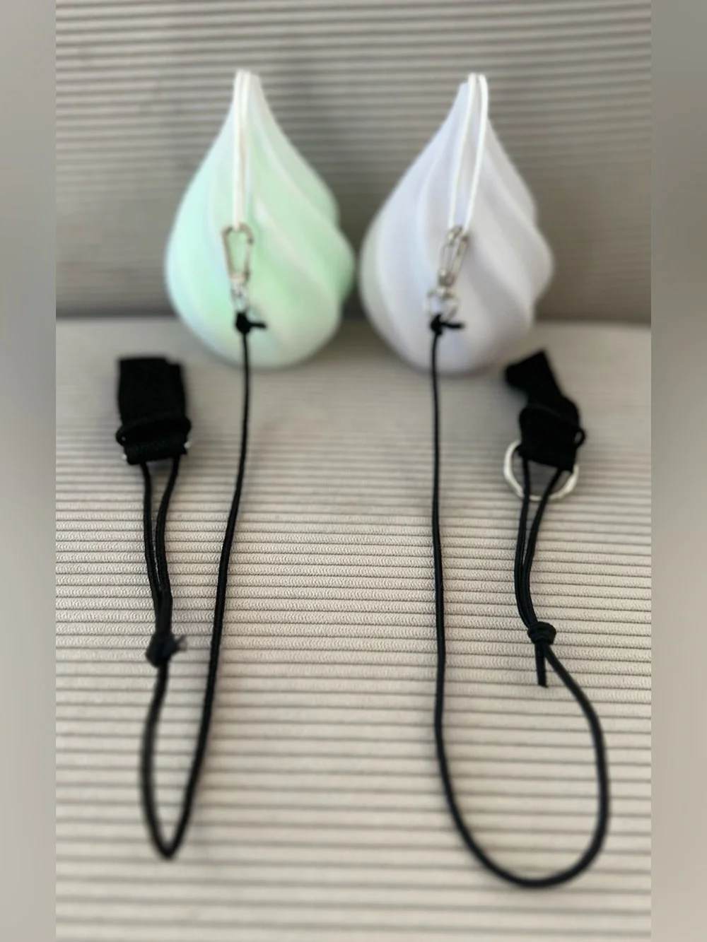 Set of swirled teardrop LED Poi balls - glowing flow arts